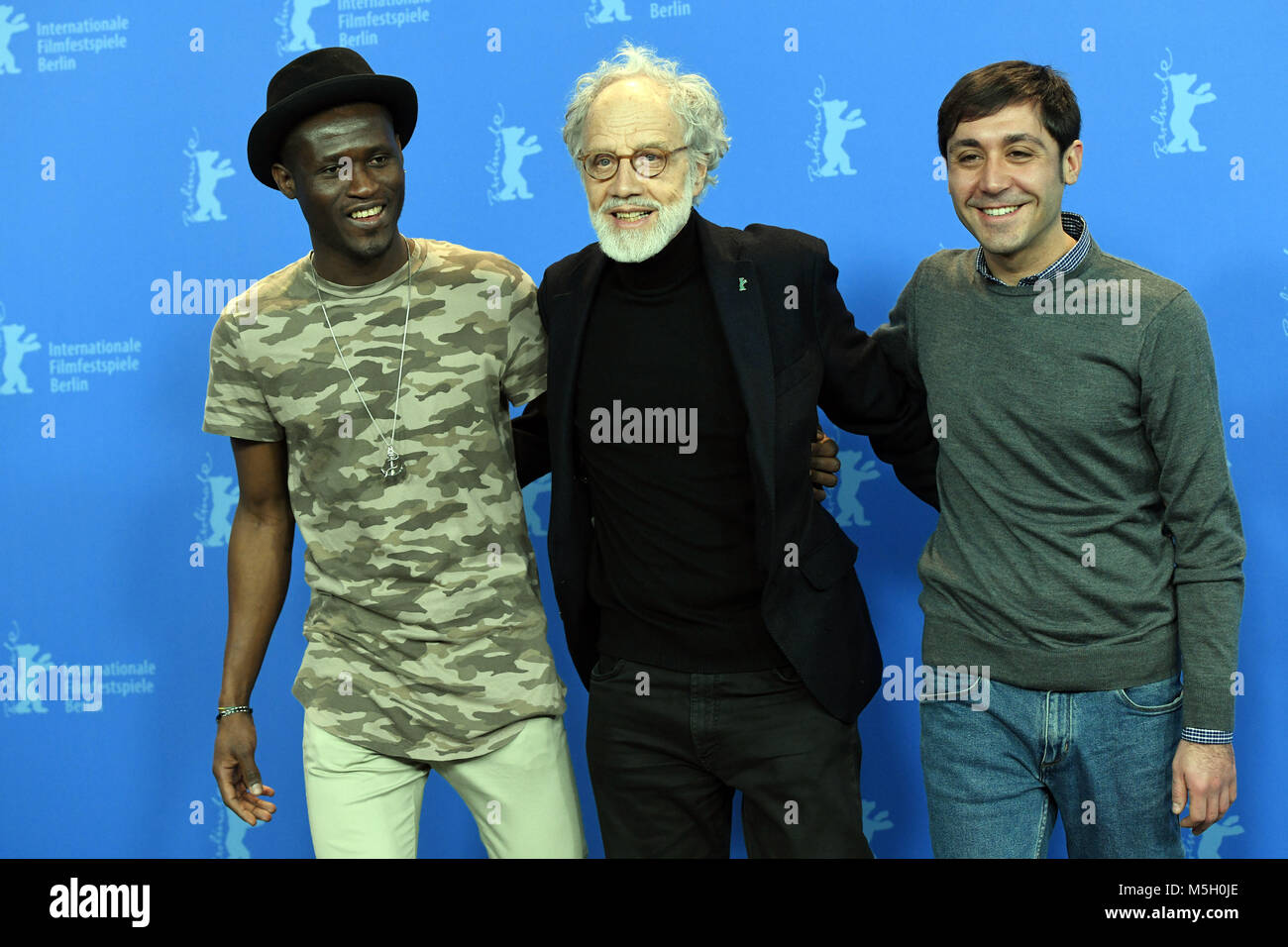 22 Febuary 2018, Germany, Berlin: Berlinale, photo session, 'Eldorado': Actor Akhet Téwendé (L-R), director Markus Imhoof, actor Raffaele Falcone. The film is running out of competition as part of the Berlinale. Credit: dpa picture alliance/Alamy Live News Stock Photo