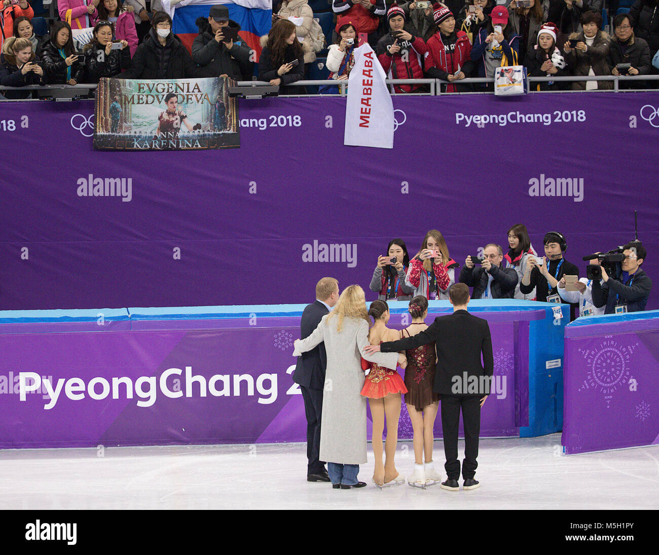 Gangneung, South Korea. 23rd Feb, 2018. Eteri Georgievna Tutberidze, 43, Russian figure skating coach hugs gold medal winner Alina Zagitova, and silver medal winner Evgenia Medvedeva of Olympic Athlete from Russia during the Ladies Single Skating Free Skating at the PyeongChang 2018 Winter Olympic Games at Gangneung Ice Arena on Friday February 23, 2018. Credit: Paul Kitagaki Jr./ZUMA Wire/Alamy Live News Stock Photo