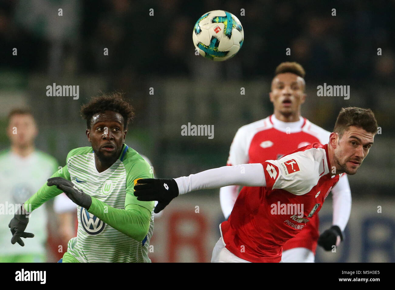 23 Febuary 2018, Germany, Mainz: German Bundesliga soccer match between FSV Mainz 05 and VfL Wolfsburg, Opel Arena. Mainz's Stefan Bell (R) and Wolfsburgs Divock Origi vie for the ball. Photo: Thomas Frey/dpa - Nutzung nur nach vertraglicher Vereinbarung Stock Photo