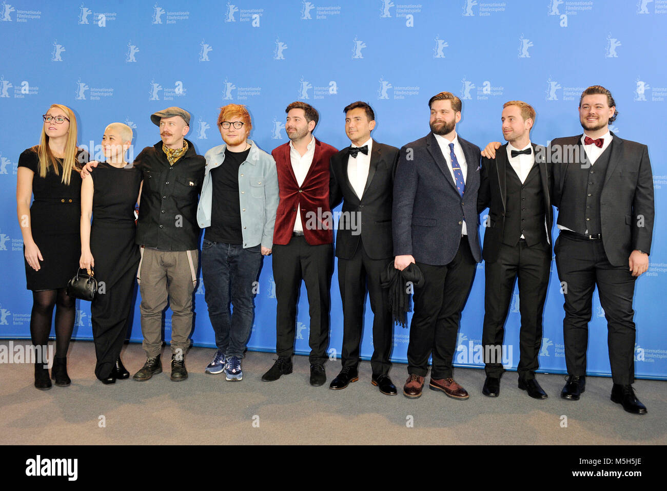 Berlin, Germany. 23rd Feb, 2018. (EDITORS NOTE: Image has been digitally retouched) l.t.r: Maleri Sevier, Kimmie Kim, Foy Vance, Ed Sheeran, Murray Cummings, Alejandro Reyes-Knight, Ben Wainwright-Pearce, Billy Cummings and William Bean photographed at the 'Songwriter' photo call during the 68th Berlin Film Festival at the Grand Hyatt Hotel on February 23, 2018 in Berlin, Germany. Credit: John Rasimus/Media Punch ***France, Sweden, Norway, Denark, Finland, Usa, Czech Republic, South America Only***/Alamy Live News Stock Photo
