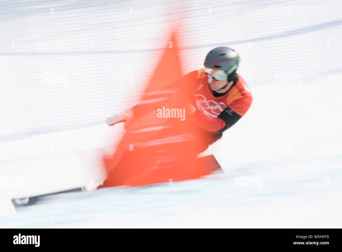Pyeongchang, South Korea. 24th Feb, 2018. Nevin Galmarini (R) of Switzerland competes during men's parallel giant slalom of snowboard at the 2018 PyeongChang Winter Olympic Games at Phoenix Snow Park, PyeongChang, South Korea, Feb. 24, 2018. Nevin Galmarini won the gold medal in the big final. Credit: Wu Zhuang/Xinhua/Alamy Live News Credit: Xinhua/Alamy Live News Stock Photo