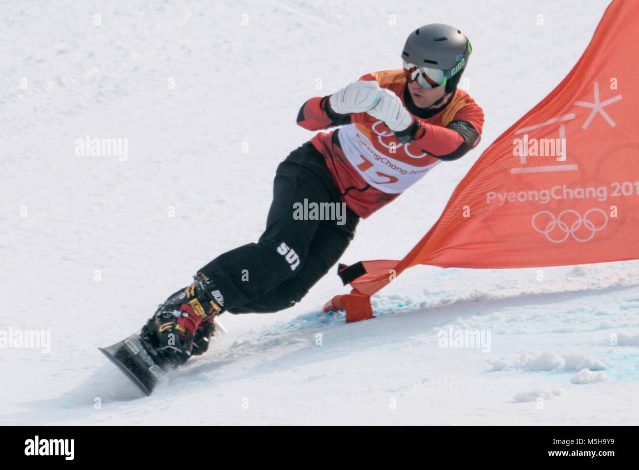 Pyeongchang, South Korea. 24th Feb, 2018. Nevin Galmarini of Switzerland competes during men's parallel giant slalom of snowboard at the 2018 PyeongChang Winter Olympic Games at Phoenix Snow Park, PyeongChang, South Korea, Feb. 24, 2018. Nevin Galmarini won the gold medal in the big final. Credit: Wu Zhuang/Xinhua/Alamy Live News Credit: Xinhua/Alamy Live News Stock Photo