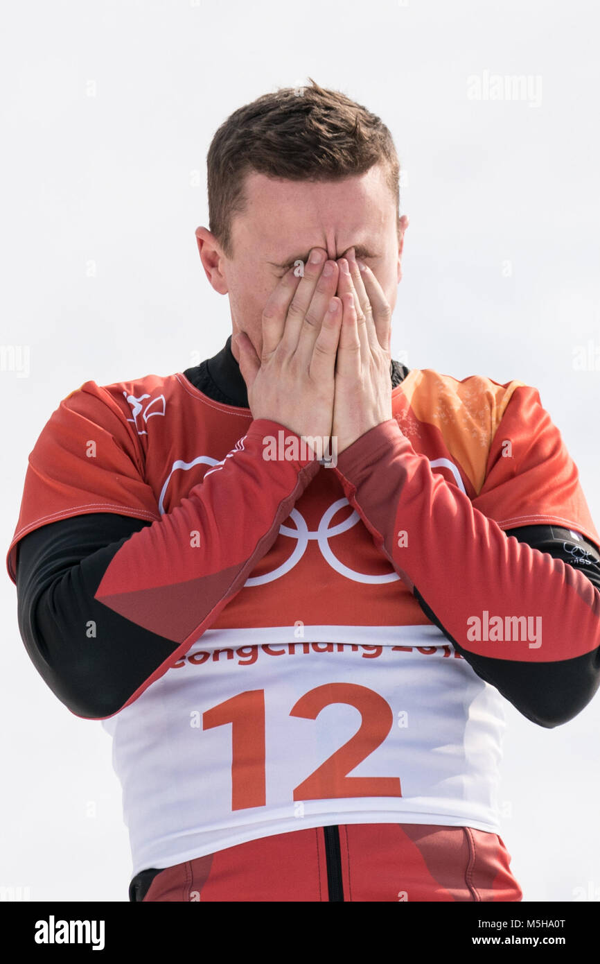 Pyeongchang, South Korea. 24th Feb, 2018. Nevin Galmarini of Switzerland celebrates after winning men's parallel giant slalom of snowboard at the 2018 PyeongChang Winter Olympic Games at Phoenix Snow Park, PyeongChang, South Korea, Feb. 24, 2018. Nevin Galmarini won the gold medal in the big final. Credit: Wu Zhuang/Xinhua/Alamy Live News Credit: Xinhua/Alamy Live News Stock Photo