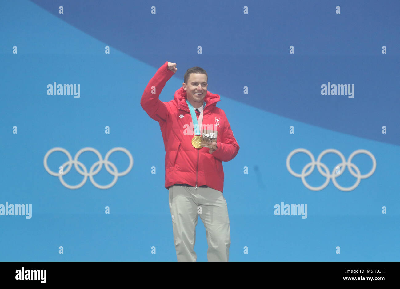 Pyeongchang, South Korea. 24th Feb, 2018. Gold medalist Nevin Galmarini of Switzerland reacts during the medal ceremony of men's parallel giant slalom big of snowboard at the 2018 PyeongChang Winter Olympic Games at Medal Plaza, PyeongChang, South Korea, Feb. 24, 2018. Credit: Li Gang/Xinhua/Alamy Live News Stock Photo
