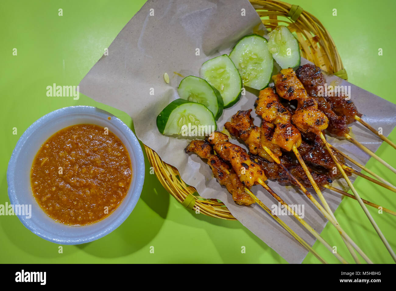 Top view of malaysian chicken satay with delicious peanut sauce, one of