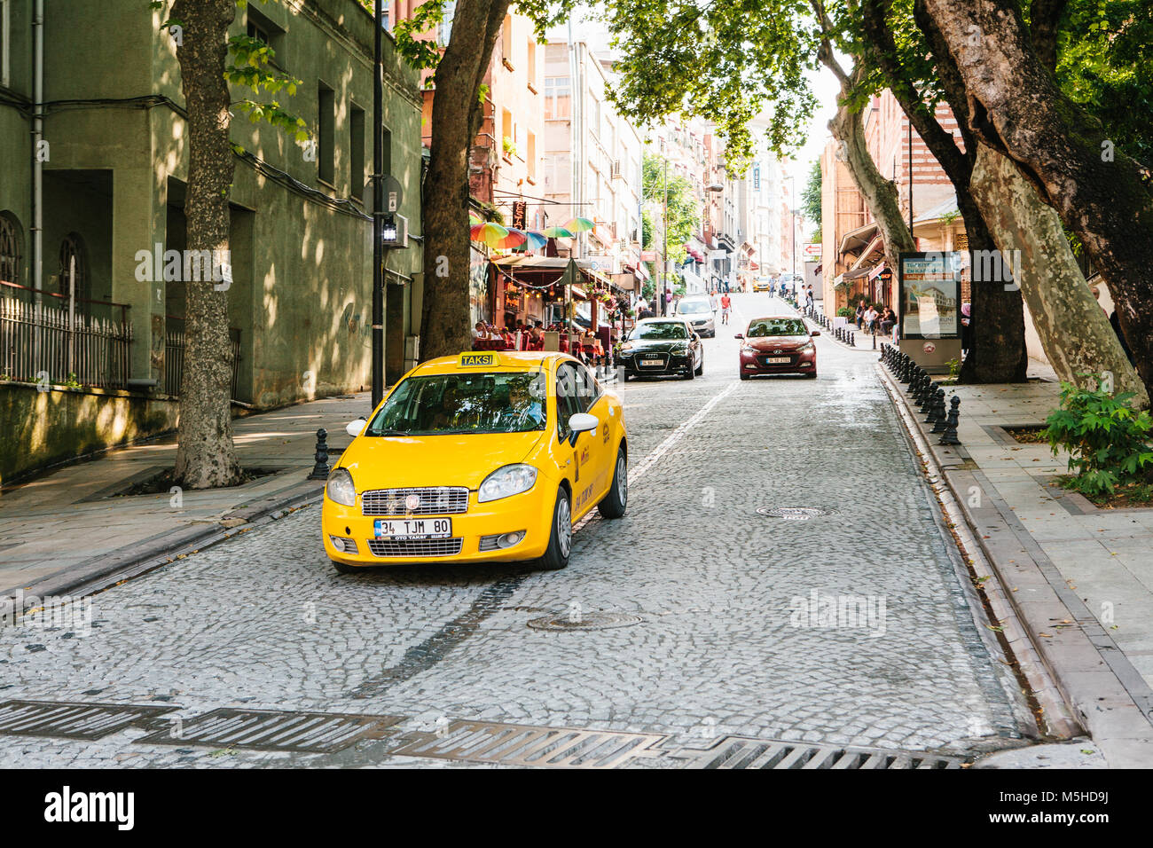 Istanbul, June 15, 2017 A traditional yellow taxi rides on the street