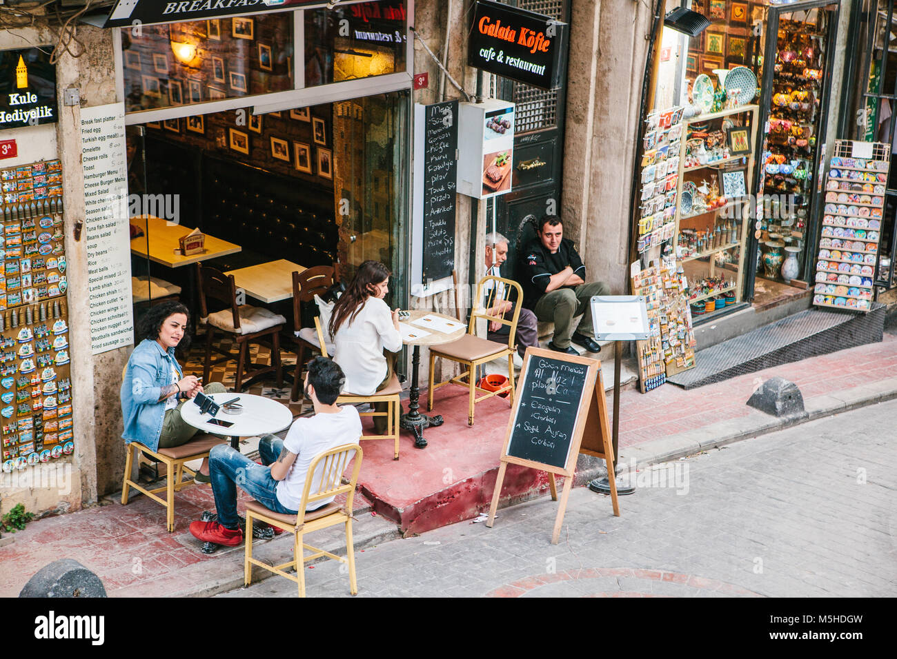Istanbul, June 15, 2017: People sitting outside Galata Kofte restaurant in Istanbul, Turkey. A popular place among tourists and local people. Stock Photo