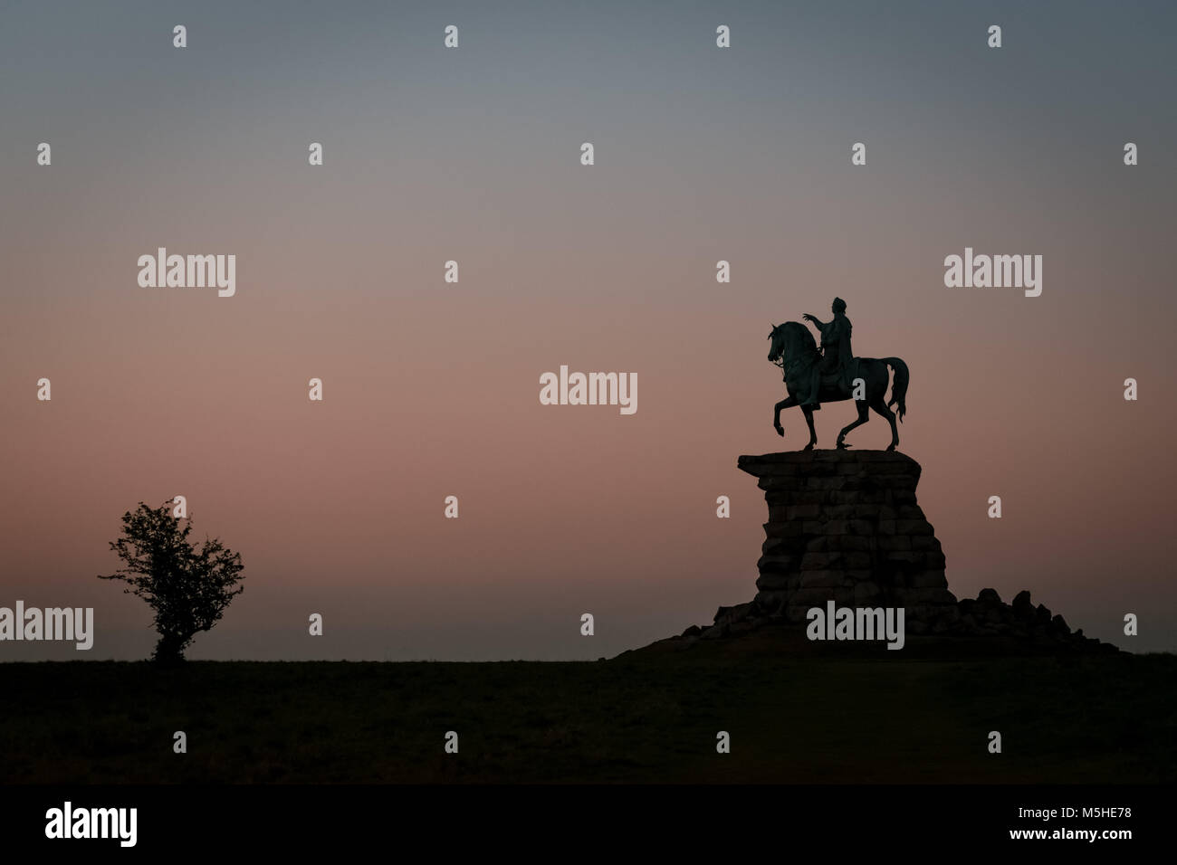 Copper Horse Statue of King George III at the end of the Long Walk in Windsor Great Park, taken just after sunset Stock Photo
