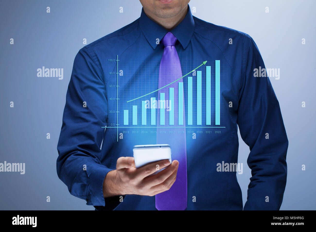 Businessman with growing chart Stock Photo - Alamy