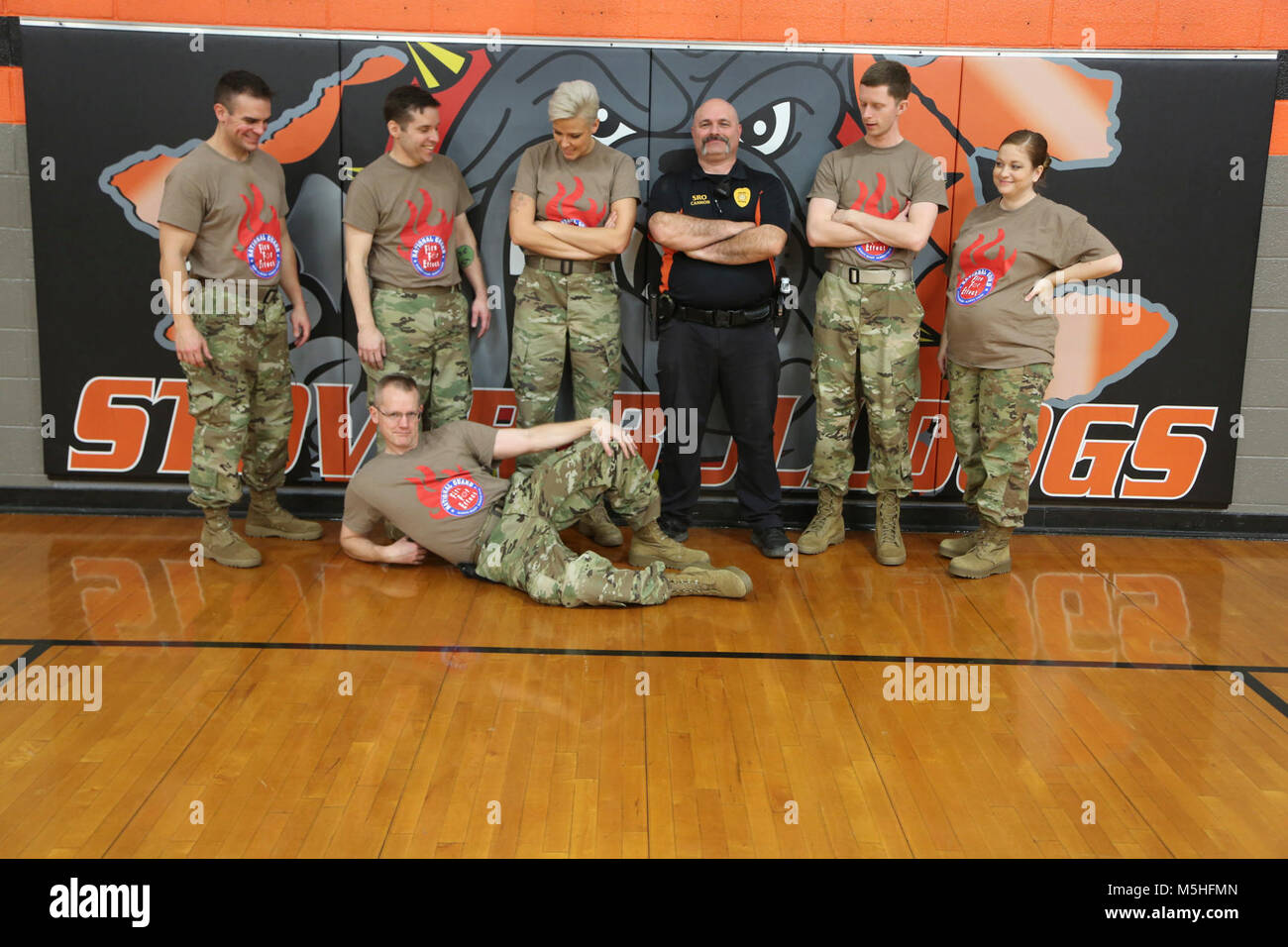 Fire For Effect band members pose with Stover school resource officer