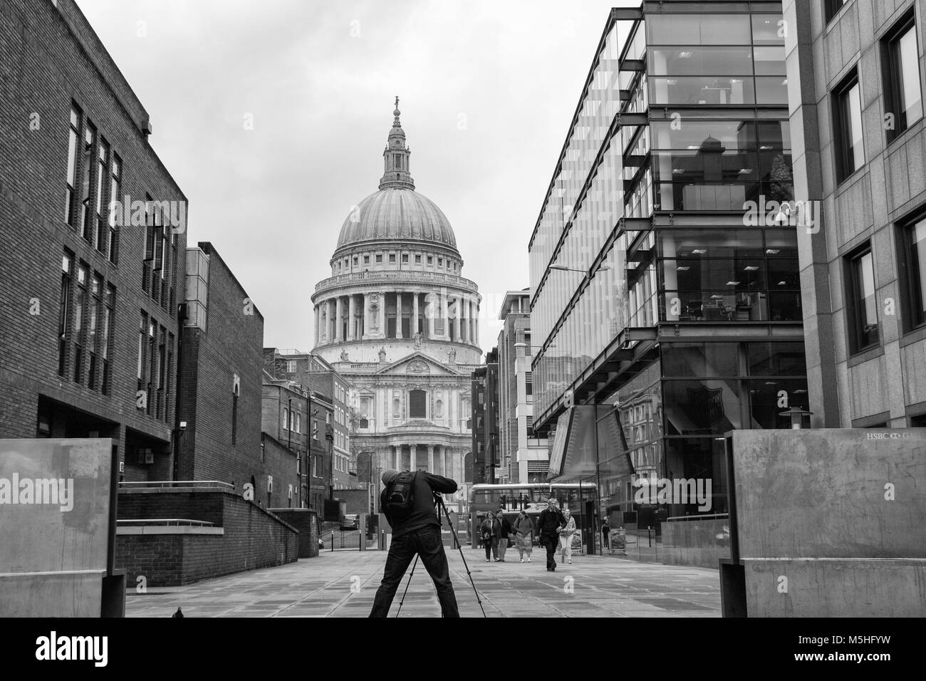 Photographer taking a photograph of St Paul's Cathedral, City of London, England, UK. Credit