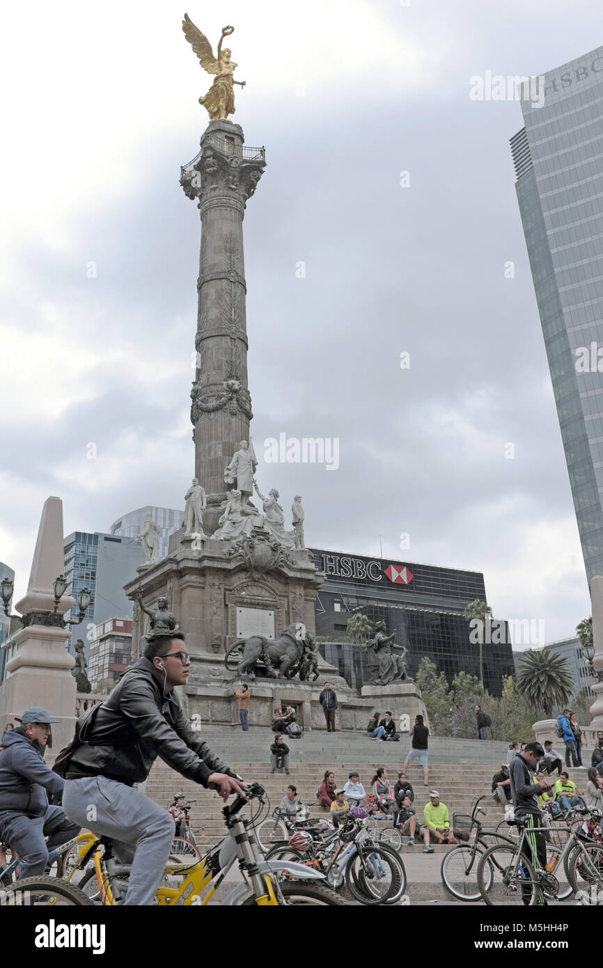 Every Sunday morning Mexico City residents take to the streets walking and biking along routes including areas around the Angel de  la Independencia. Stock Photo