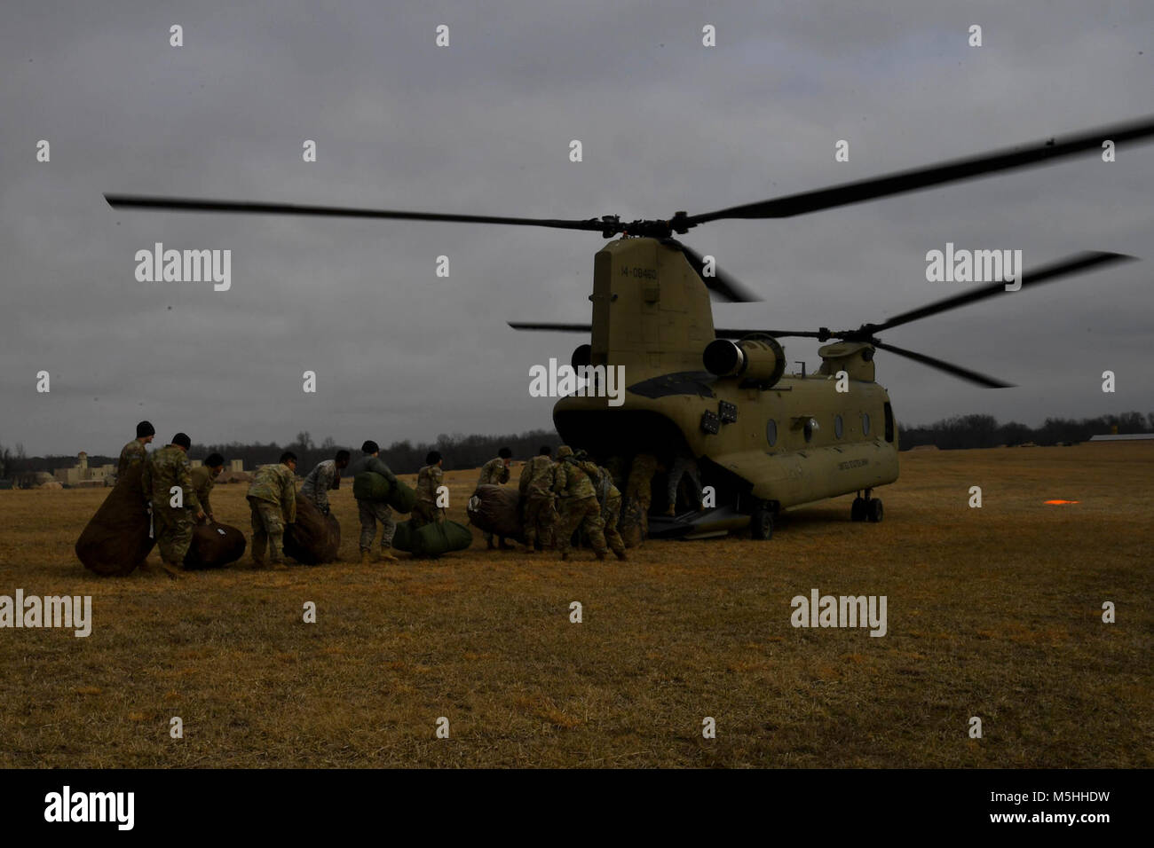 Soldiers with the 101st Combat Aviation Brigade, 101st Airborne Division (Air Assault) load equipment into a CH-47 Chinook helicopter in preparation to jump their tactical operations center (TOC) to a new location during Warfighter, a two-week command and control exercise February 13, 2017 at Ft. Campbell, Ky. (U.S. Army Stock Photo