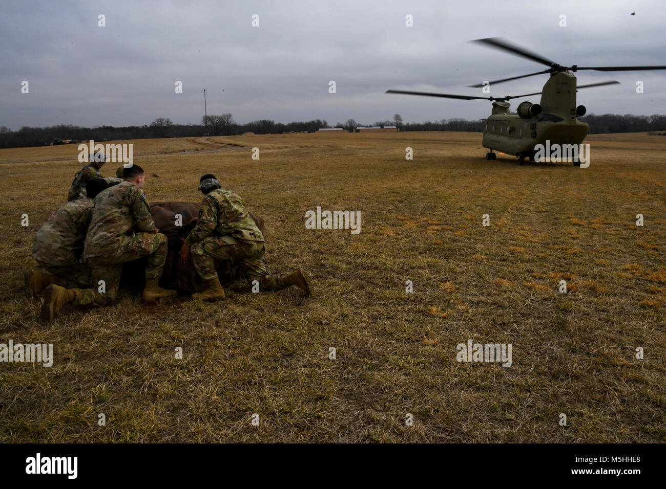 Soldiers with the 101st Combat Aviation Brigade, 101st Airborne Division (Air Assault) load equipment into a CH-47 Chinook helicopter in preparation to jump their tactical operations center (TOC) to a new location during Warfighter, a two-week command and control exercise February 13, 2017 at Ft. Campbell, Ky. (U.S. Army Stock Photo