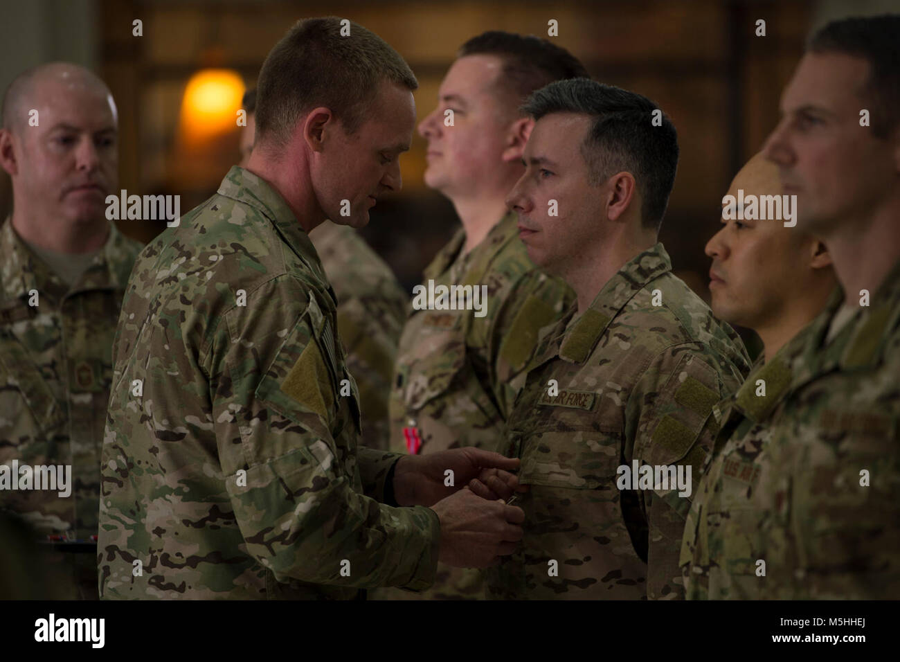 Lt. Col. Eli Mitchell, commander of the 720th Operations Support Squadron, pins the Bronze Star Medal on Maj. Justin Manley, a surgeon with the 720th OSS, during a ceremony at the University of Alabama at Birmingham, Alabama, Feb. 13, 2017. Manley was one of five members of a Special Operations Surgical Team who were awarded the Bronze Star Medal for their actions while deployed in support of Operation INHERHENT RESOLVE. SOSTs are surgical teams highly trained in providing life-saving care any time, any place.  (U.S. Air Force Stock Photo