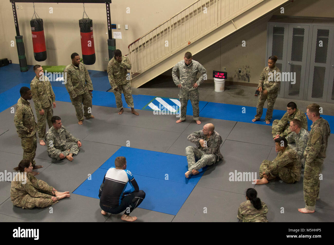 Soldiers assigned to 2nd Armored Brigade Combat Team receive their next grappling technique from Capt. Andrew Alterman, a chaplain assigned to 9th Engineer Battalion, 2nd Armored Brigade Combat Team, 3rd Infantry Division during a chaplain’s inspirational combatives training session, February 13, 2018, at Fort Stewart, Ga. 3ID Soldiers training in close quarters combatives level I as well as the Fort Stewart combatives team were tasked with executing a series of instructed grappling techniques paired alongside inspirational guidance from the chaplain. (U.S. Army Stock Photo