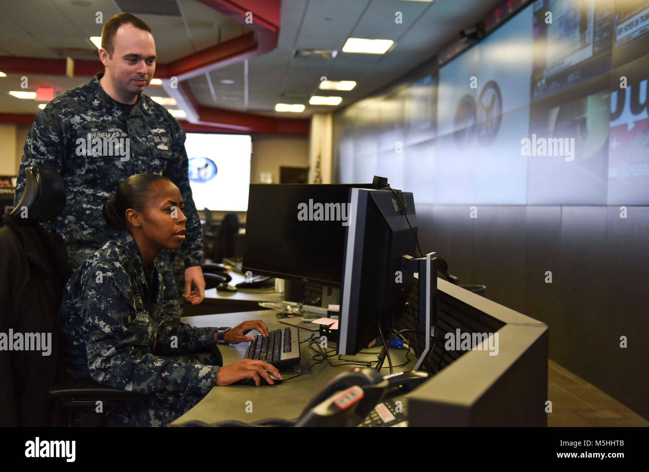 FORT GEORGE G. MEADE, Md. (Dec. 14, 2017) Information Systems Technician 1st Class Christopher Thunem and Intelligence Specialist 3rd Class Sha’kera Rodriquez stand watch in the Fleet Operations Center at the headquarters of U.S. Fleet Cyber Command/U.S. 10th Fleet. U.S. Fleet Cyber Command serves as the Navy component command to U.S. Strategic Command and U.S. Cyber Command. U.S. 10th Fleet is the operational arm of Fleet Cyber Command and executes its mission through a task force structure. (U.S. Navy Stock Photo