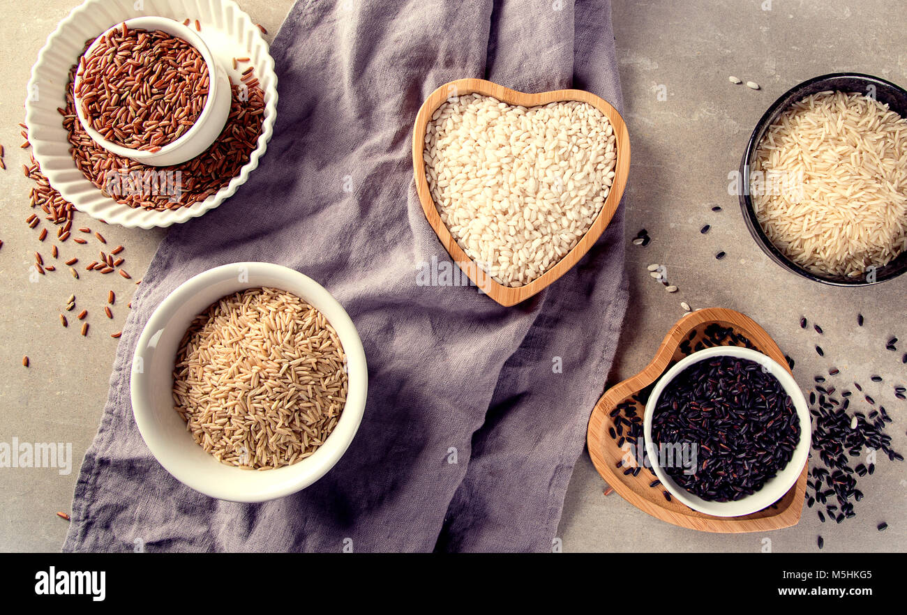 Different kinds of rice grains. Top view Stock Photo - Alamy