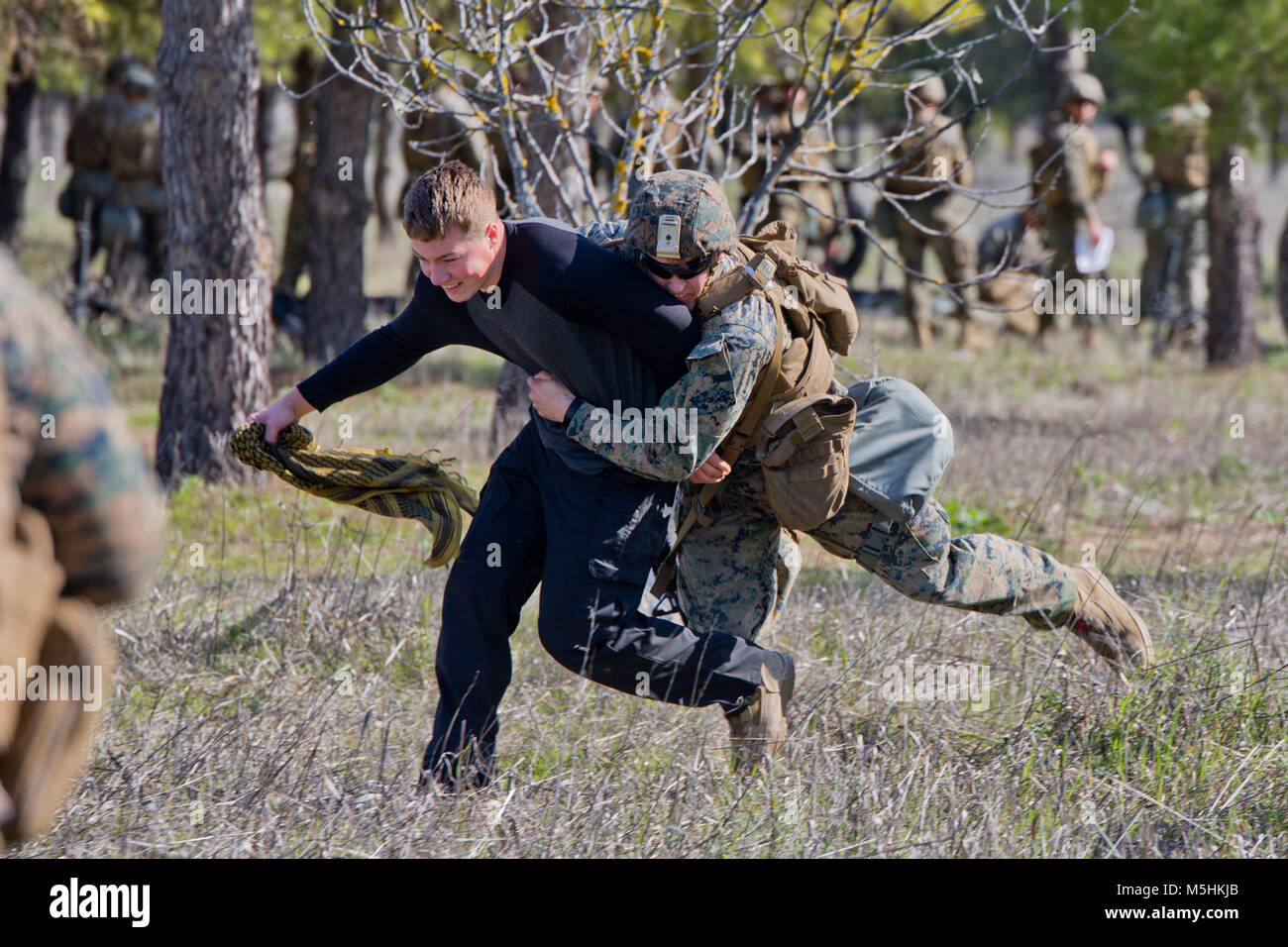 A U.S. Marine with Special-Purpose Marine Air-Ground Task Force-Crisis Response-Africa, logistics combat element, detains a role player at Morón Air Base, Spain, Feb. 7, 2018. SPMAGTF-CR-AF is deployed to conduct limited crisis-response and theater-security operations in Europe and North Africa. (U.S. Marine Corps Stock Photo