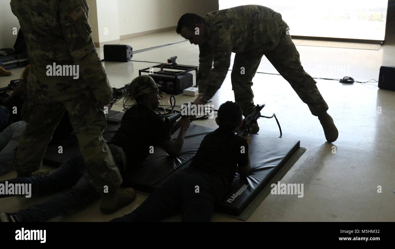 U.S. Army Staff Sgt. Robert Stallings, Austin South station commander, assists prospective Soldiers with the Electronic Shooting Training during the San Marcos Recruiting Company Future Soldier Mega Event hosted by the 363rd Quartermaster Battalion on Saturday, Feb. 10, 2018. The event was designed to train recruits on several fundamental soldiering skills before their arrival at Basic Combat Training over the summer. (U.S. Army Reserve Stock Photo