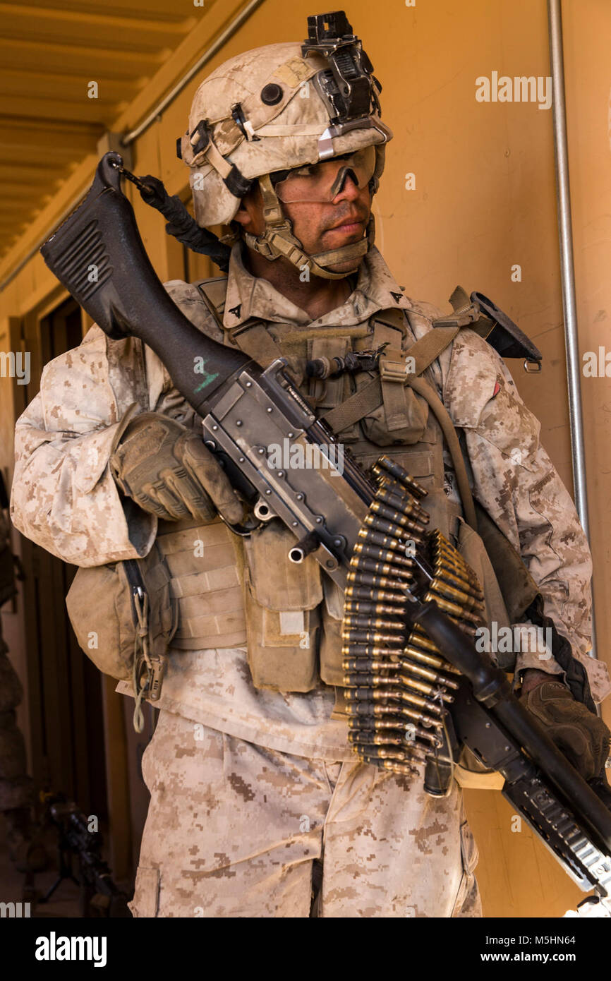 Lance Cpl. Alexander Barron, machine gunner, 3rd Battalion, 7th Marine Regiment, prepares to receive orders at Range 220 aboard the Marine Corps Air Ground Combat Center, Twentynine Palms, Calif.,  Feb. 9, 2018 as part of Integrated Training Exercise 2-18. The purpose of ITX is to create a challenging, realistic training environment that produces combat-ready forces capable of operating as an integrated MAGTF. (U.S. Marine Corps Stock Photo