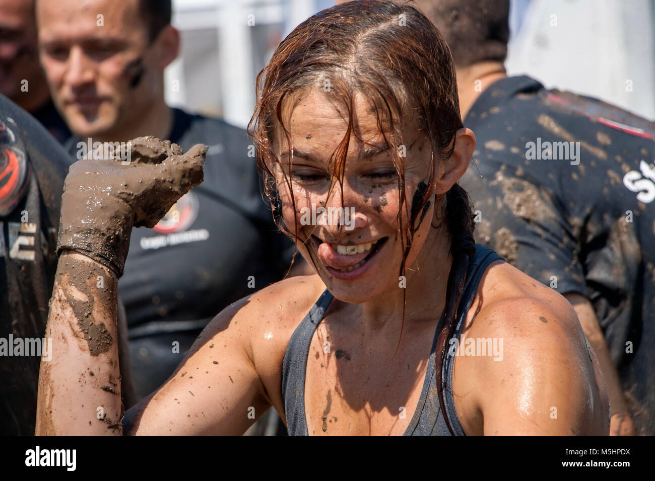 A woman having fun after participation in strength race Legion Run held in Sofia, Bulgaria on 26 July 2014 Stock Photo