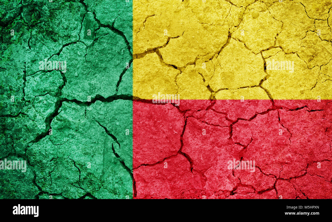 Benin flag on dry earth ground texture background Stock Photo