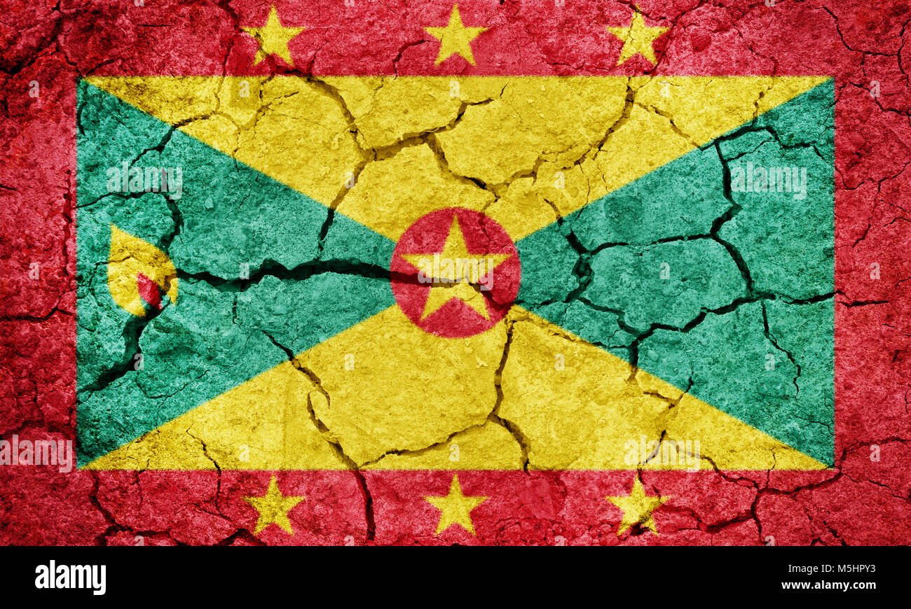 Grenada flag on dry earth ground texture background Stock Photo - Alamy