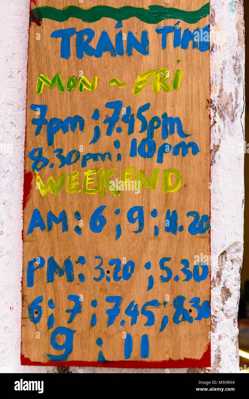 Timetable at 'Hanoi Train Street', a narrow street in the centre of Hanoi with live railway tracks on which many families live, cook, eat and wash. Stock Photo