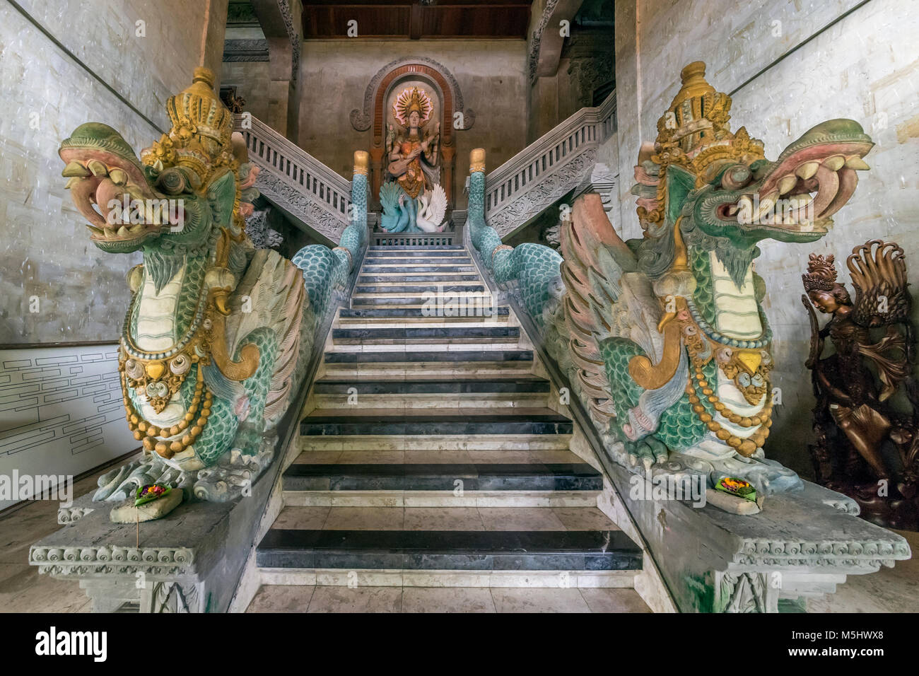 Ornate dragon staircase, old mansion, Ubud, Bali Stock Photo
