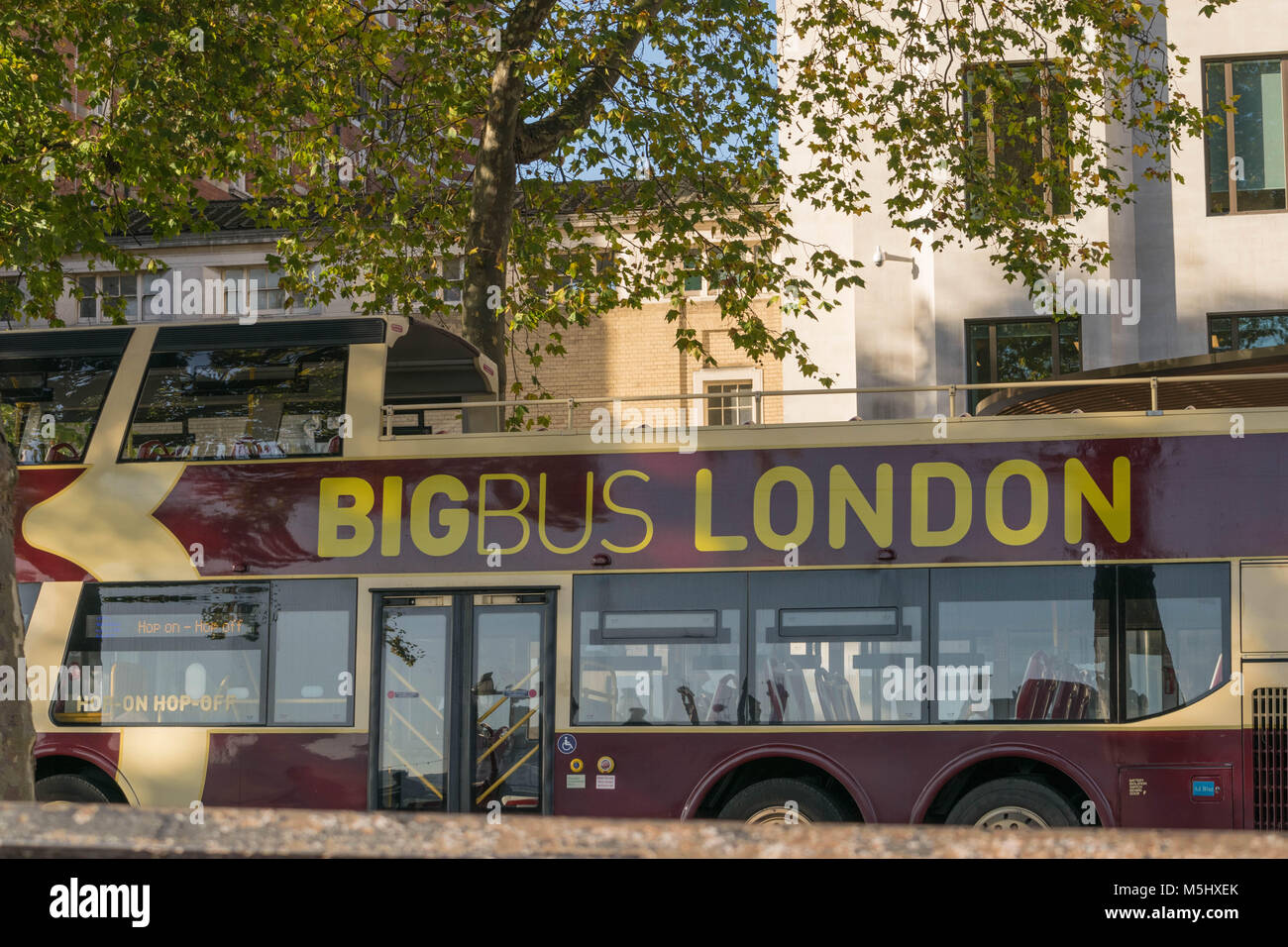 London, United Kingdom, February 17, 2018: Big Bus Company sightseeing tour near Westminster Abbey. More than 30 Million people visit London every year Stock Photo