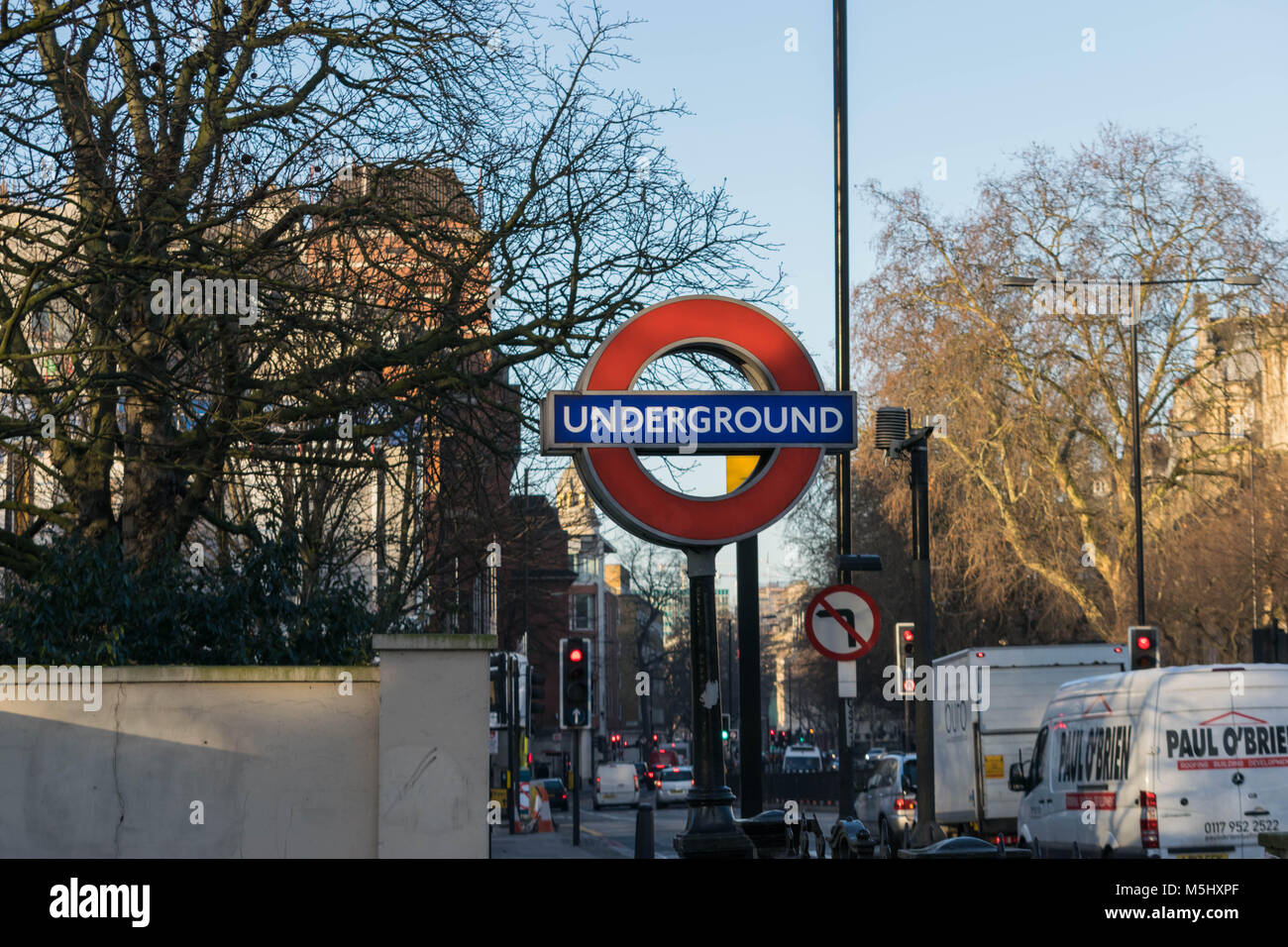 London, United Kingdom, February 17, 2018: London underground sign on the background of a park. Stock Photo
