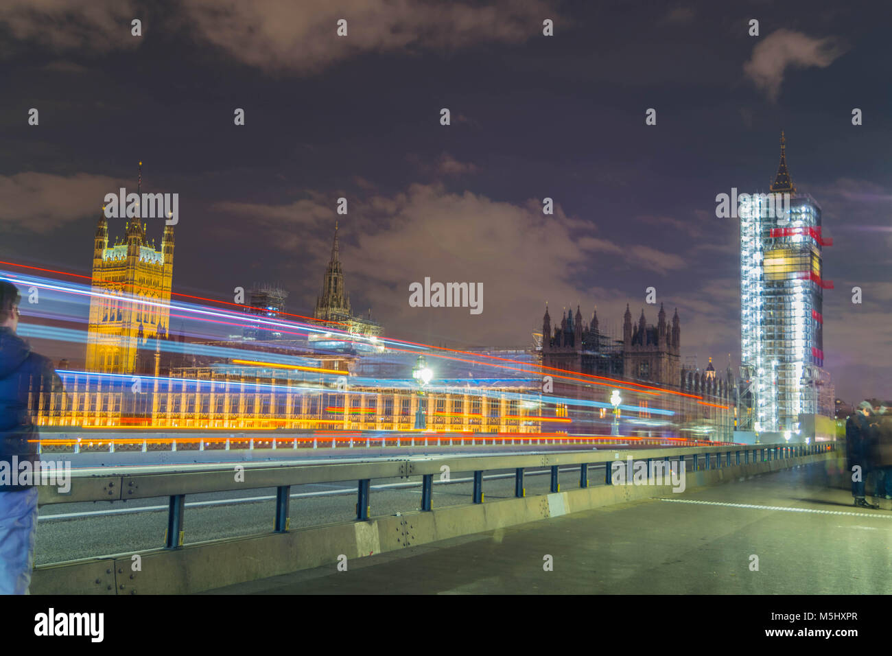 London, United Kingdom, February 17, 2018: long exposure shot of Westminster bridge and big ben renovation scaffolding construction with the house of parliament in view. Stock Photo