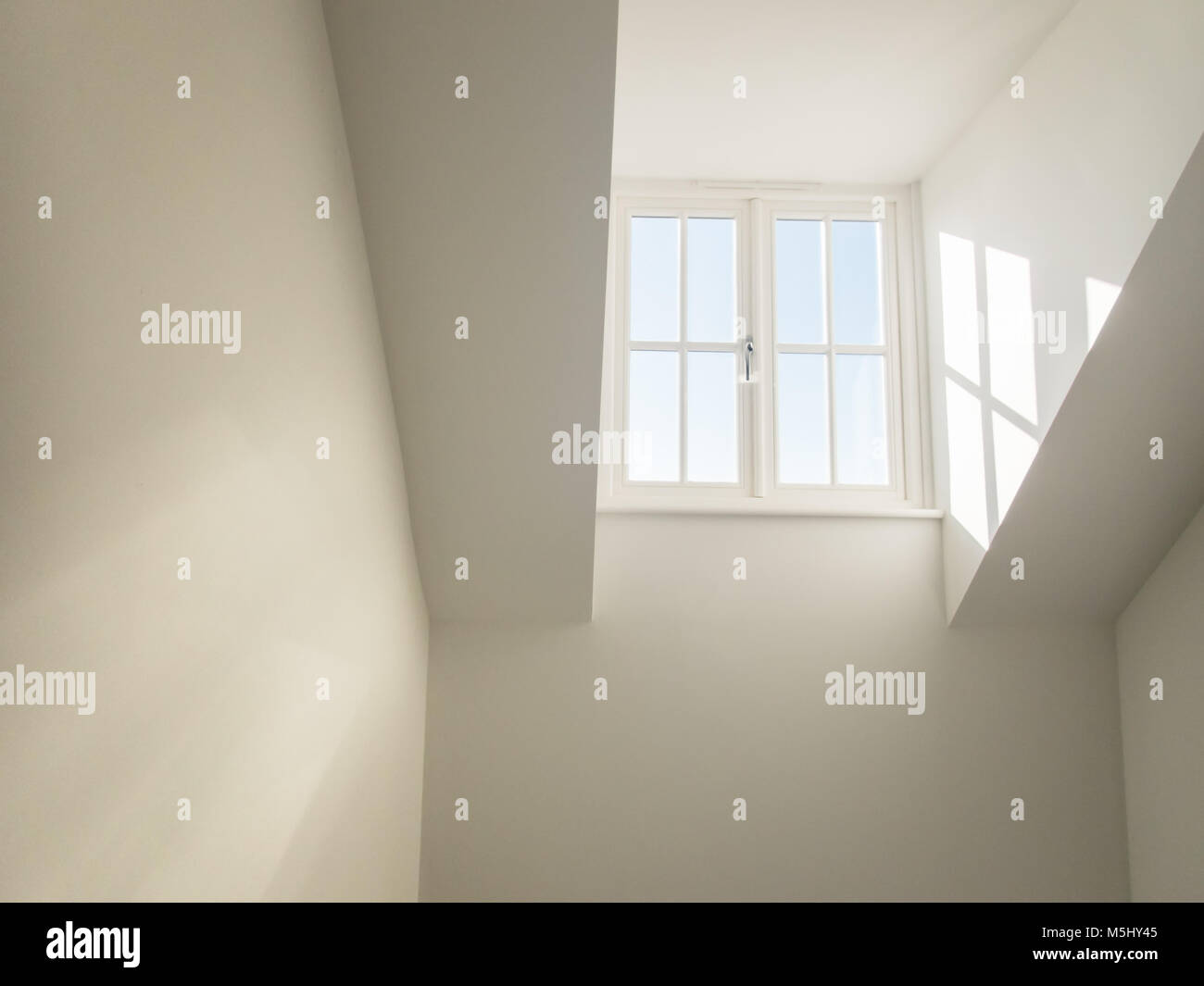 high dormer window acting as a sky light in a hall way shedding natural
