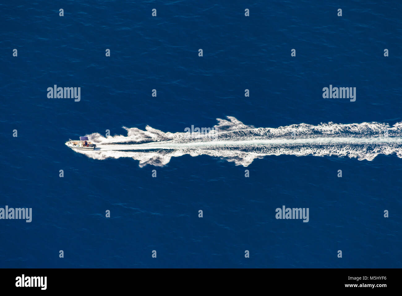 Aerial view of a speed boat in blue sea Stock Photo - Alamy