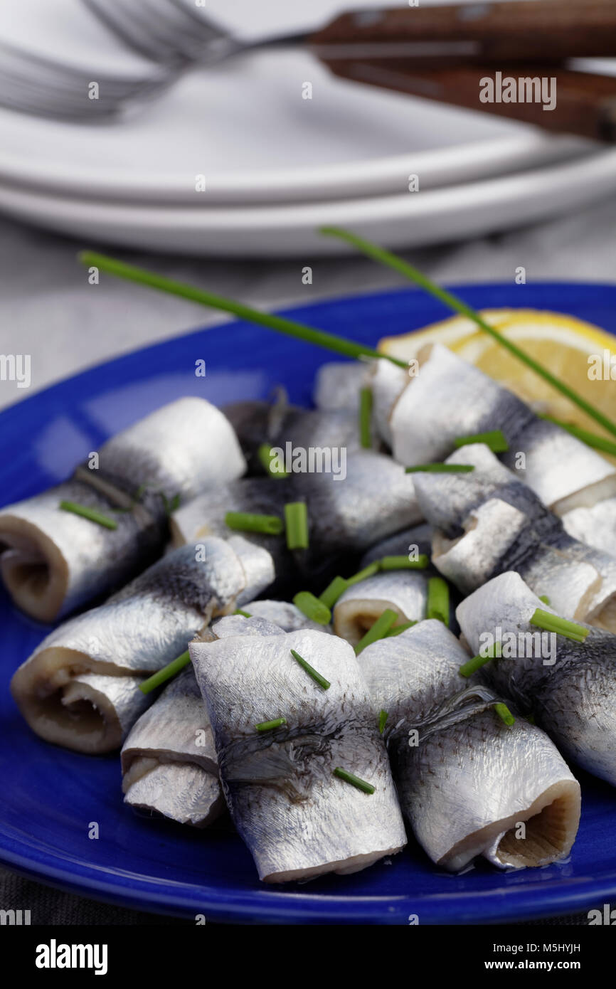 Rollmops the traditional German herring fillet rolls with green onion