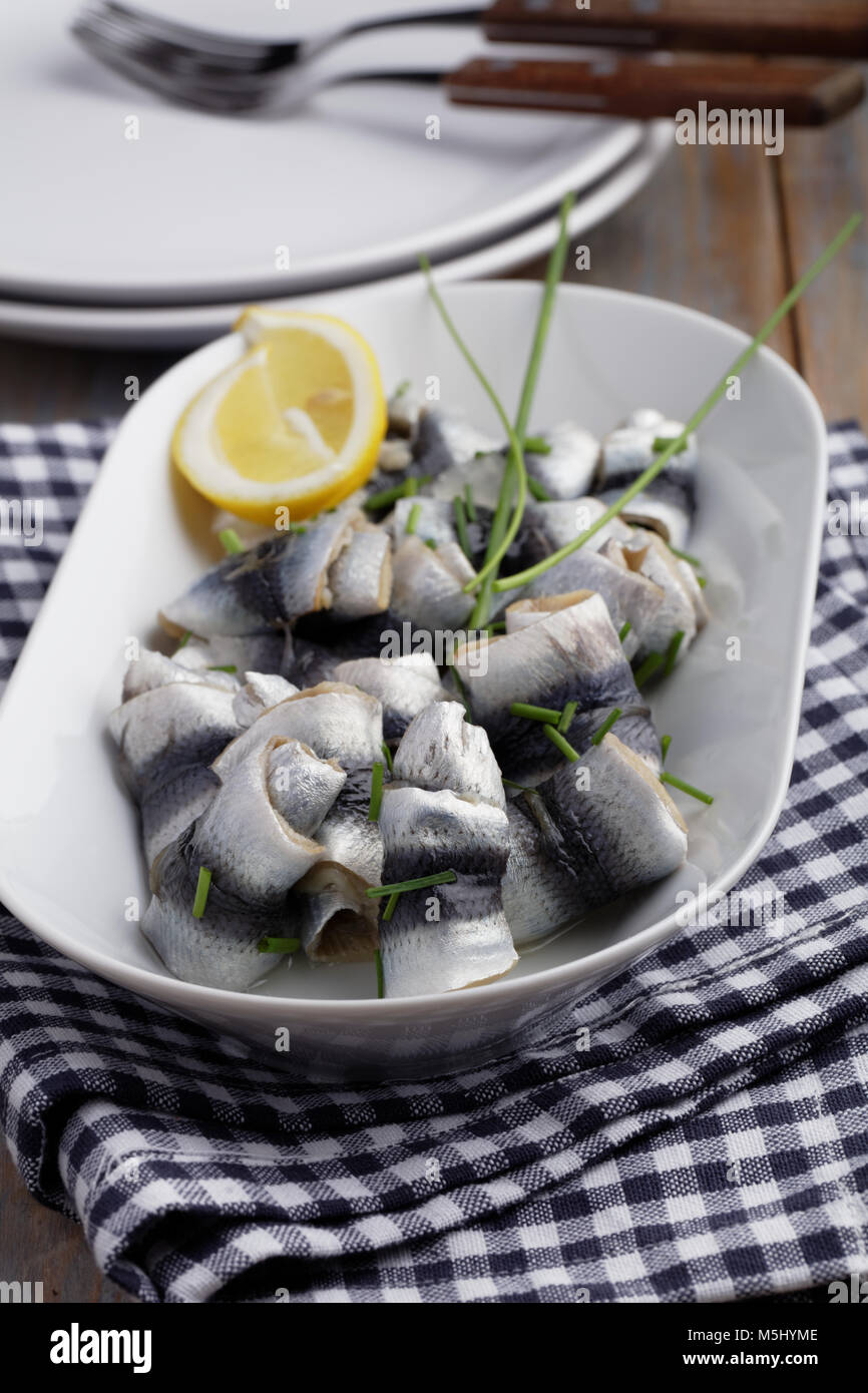 Rollmops the traditional German herring fillet rolls with green onion
