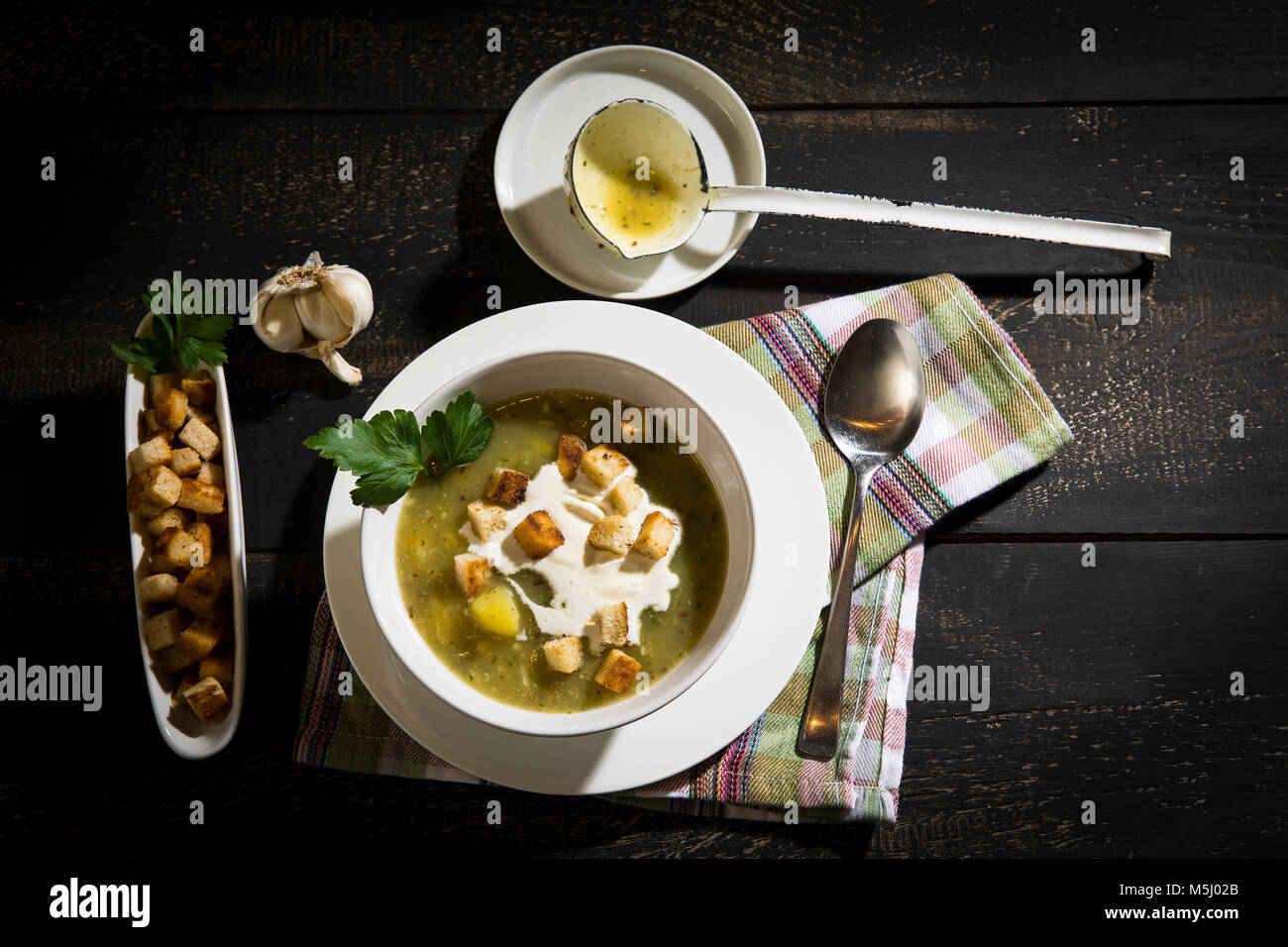 Garlic cream soup with croutons Stock Photo