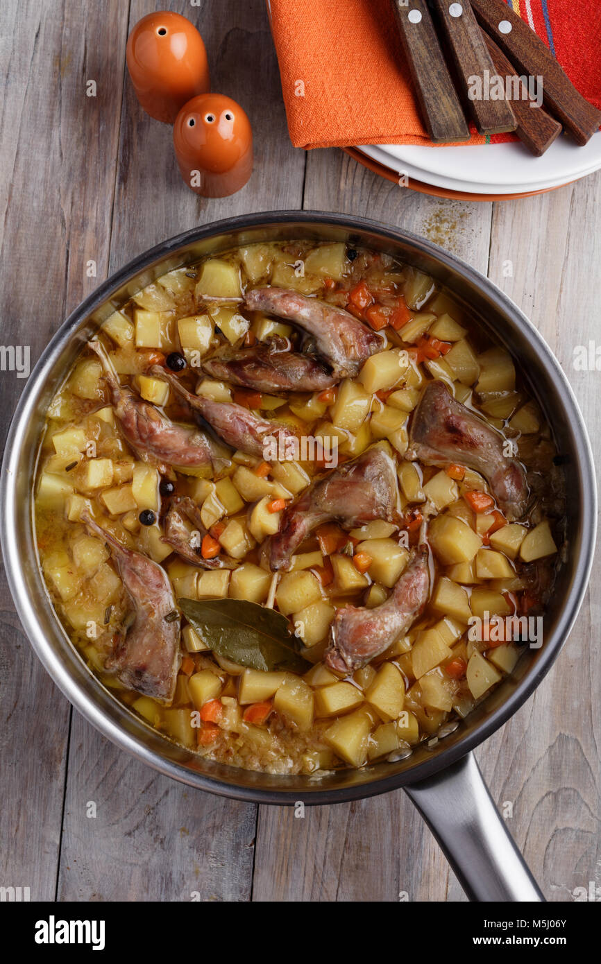 Quail legs and vegetables stew in a cooking pan Stock Photo Alamy