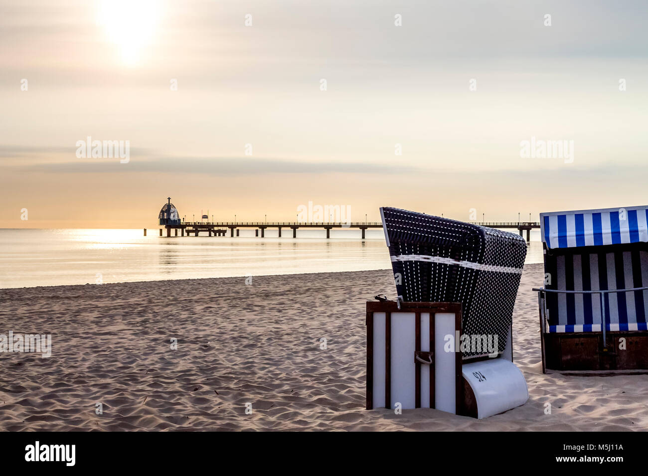 Germany, Mecklenburg-Western Pomerania, Zinnowitz, sea bridge and beach in the evening Stock Photo