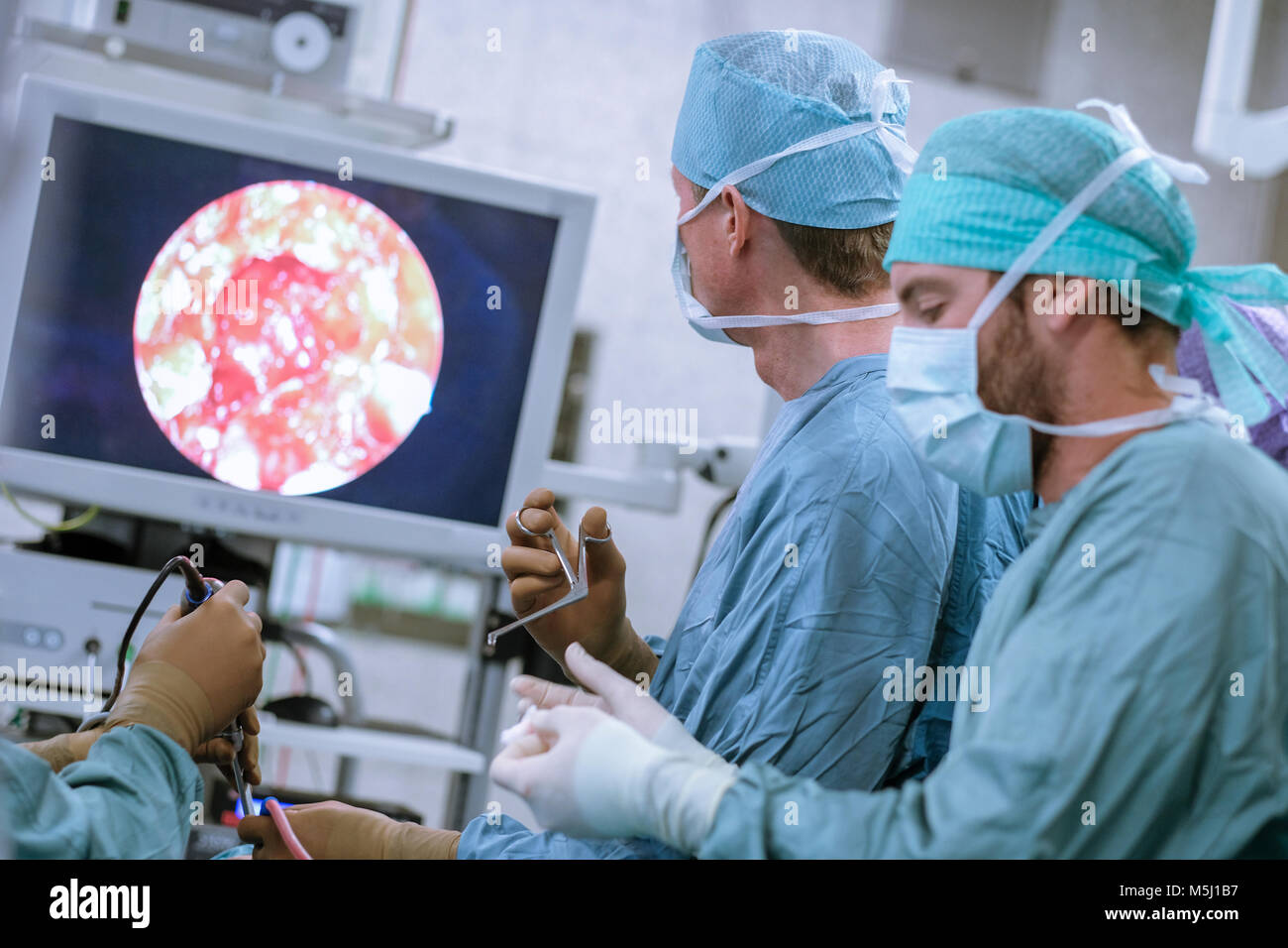 Neurosurgeons in scrubs during an operation Stock Photo Alamy