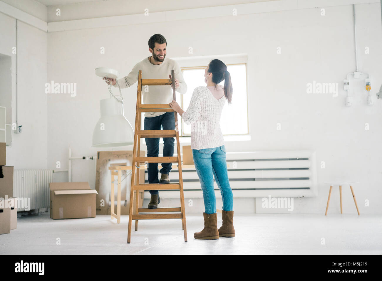 Couple moving into new home Stock Photo - Alamy