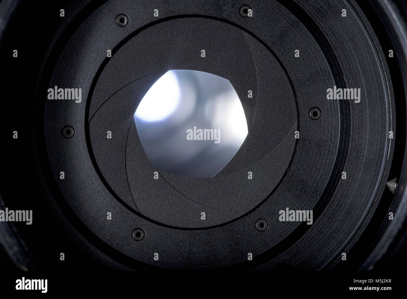 Analog photographic camera parts, diaphragm blades, mechanism and controls details high