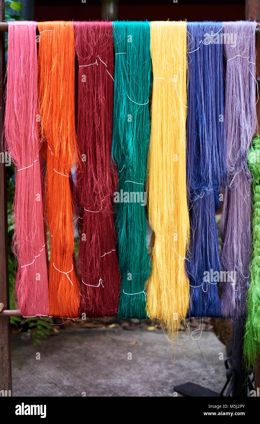 Colorful silk fiber hanging outside in a silk fabric, Bangkok Thailand. Stock Photo
