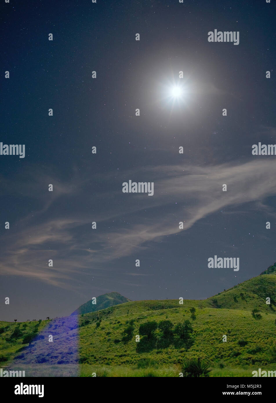 moon in the night sky over the mountain Stock Photo