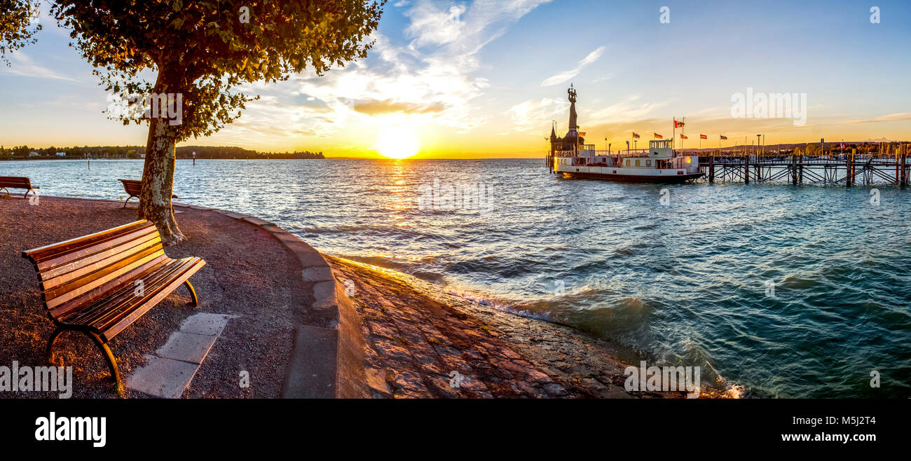 Germany, Baden-Wuerttemberg, Constance, Lake Constance, Impera at harbour entrance, sunrise Stock Photo
