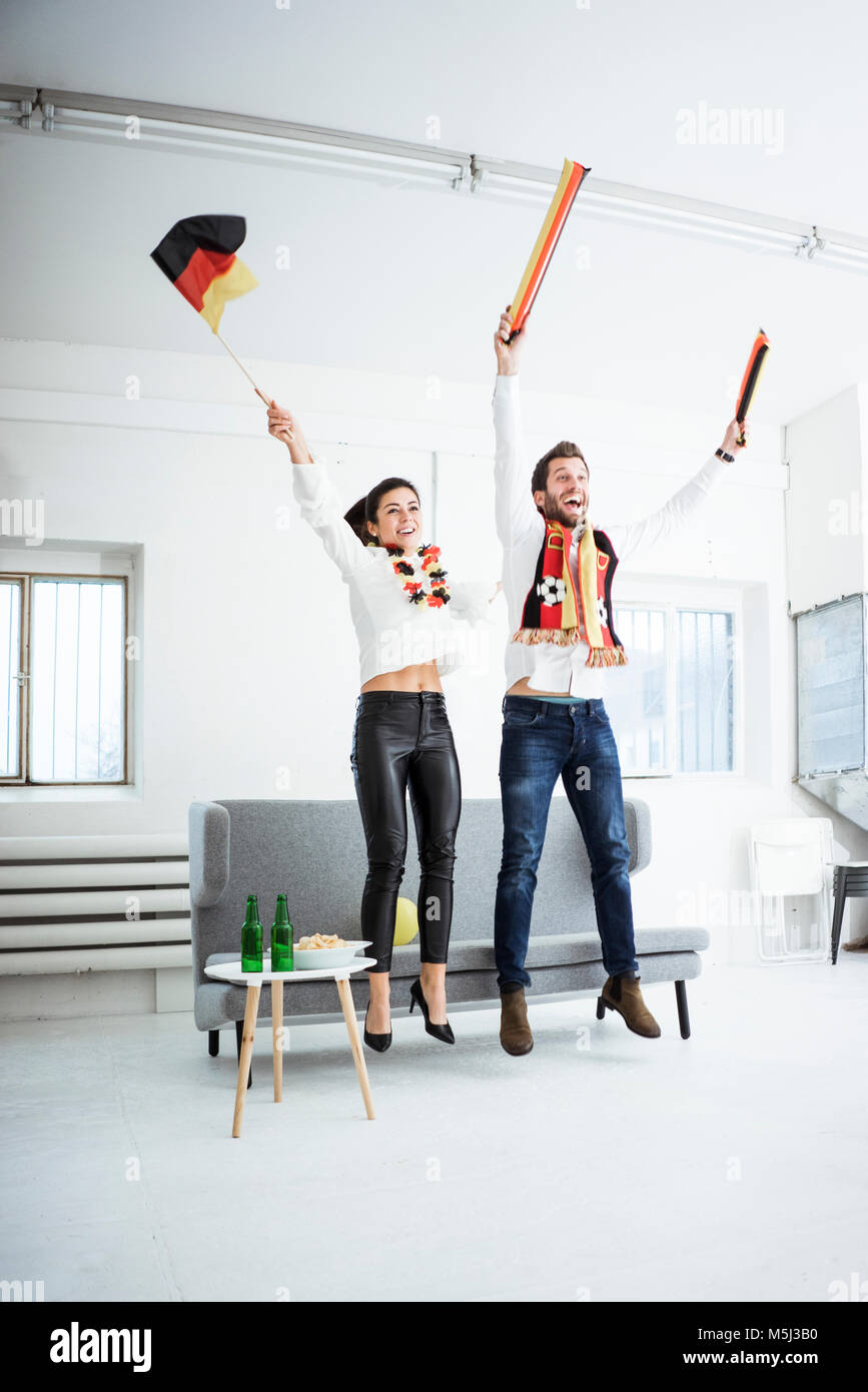 Excited German football fans cheering Stock Photo