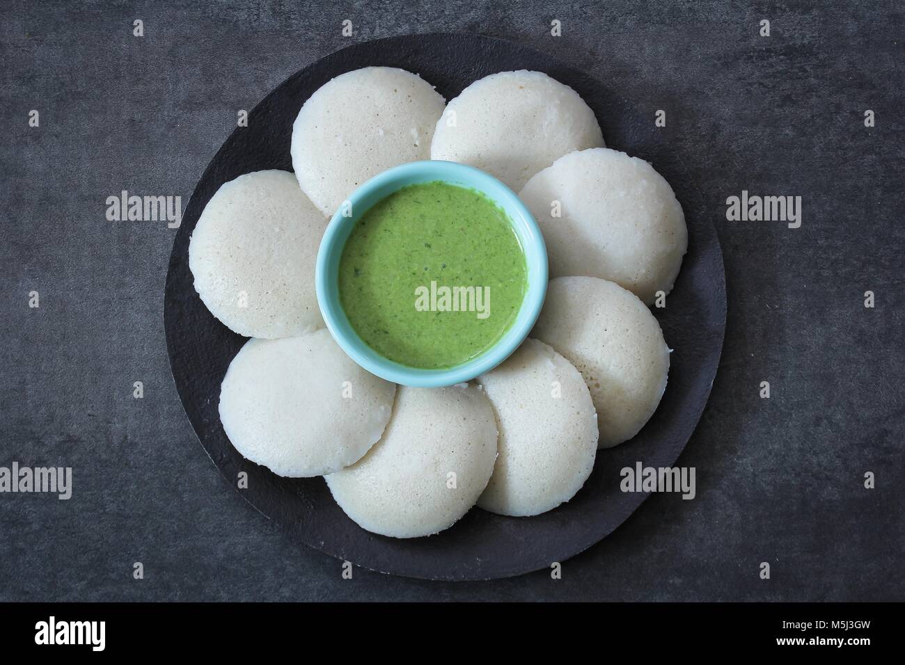 Idli / Idly food South Indian breakfast with chutney top view Stock Photo