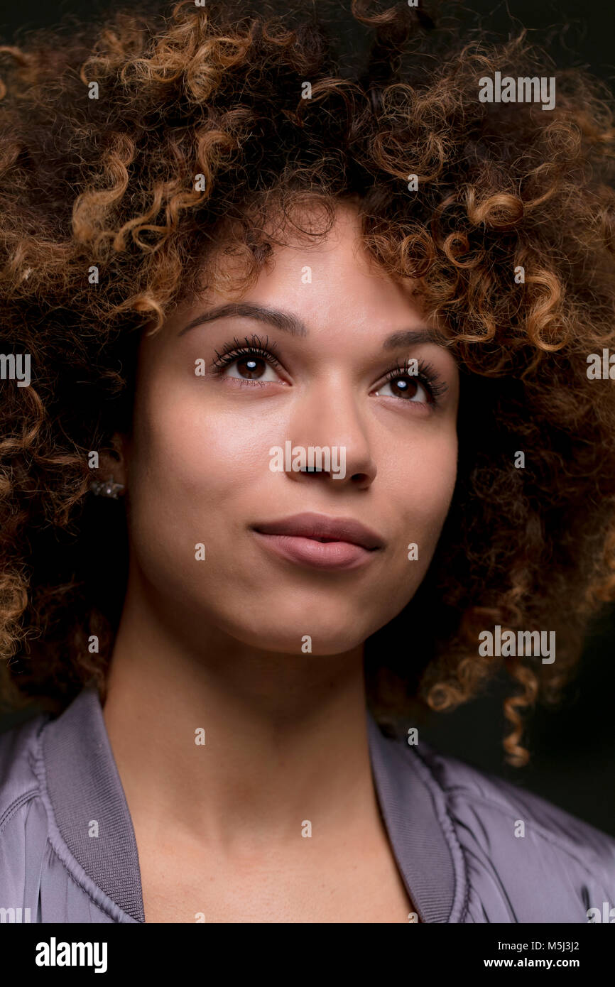 Woman curly brown hair eyes hi-res stock photography and images - Alamy