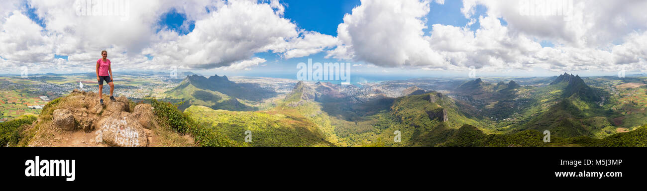 Mauritius, Le Pouce Mountain, female hiker, St. Pierre, Port Louis and summits of Snail Rock, Grand Peak, Creve Coeur and Pieter Both Stock Photo